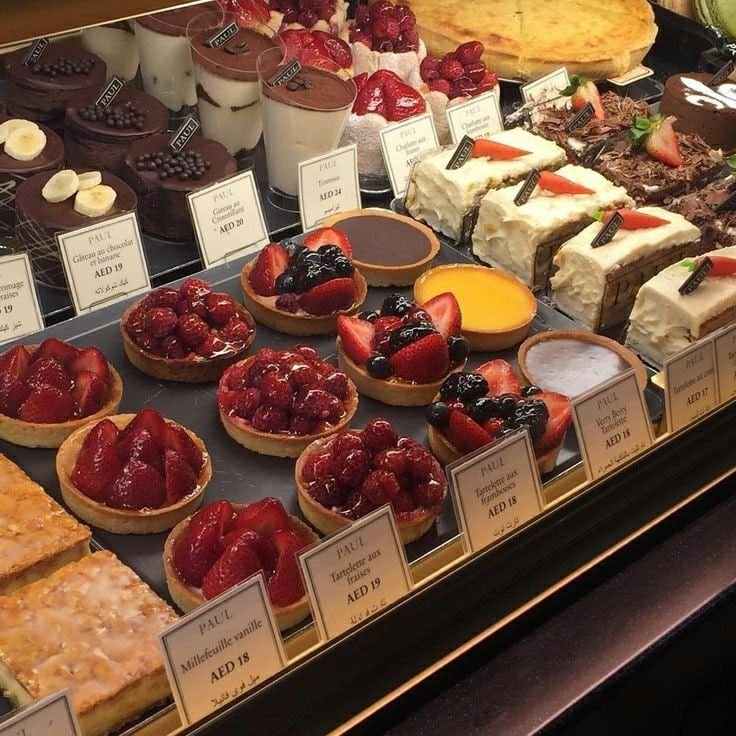 real fruit cakes with natural ingreditents behind the glass shelf